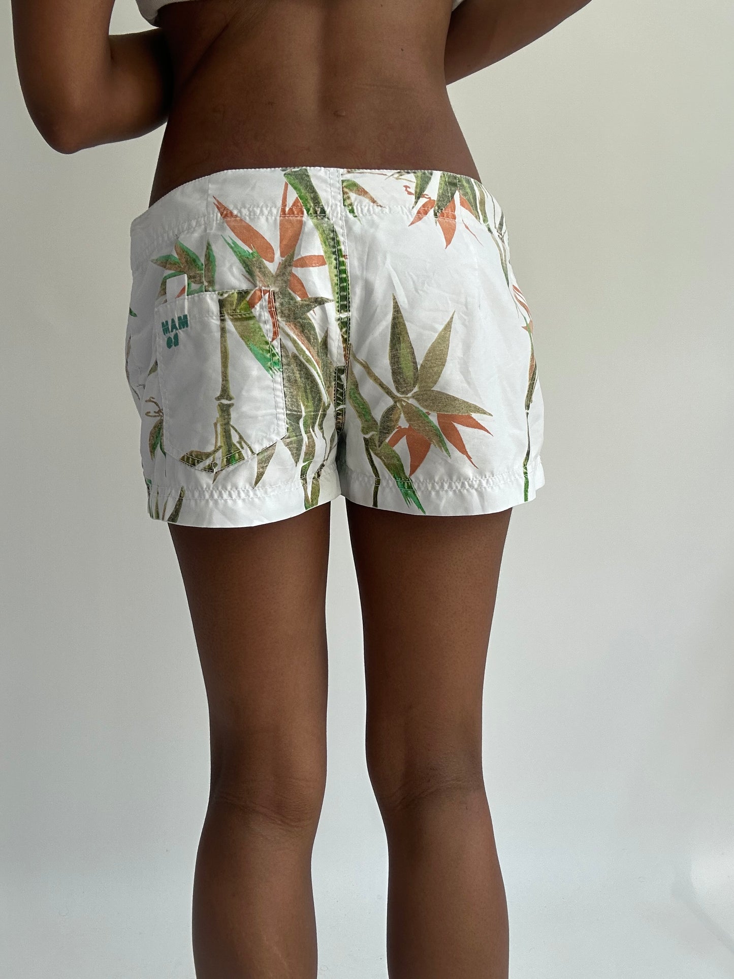summermaxxing drop | medium white leaf print mini shorts