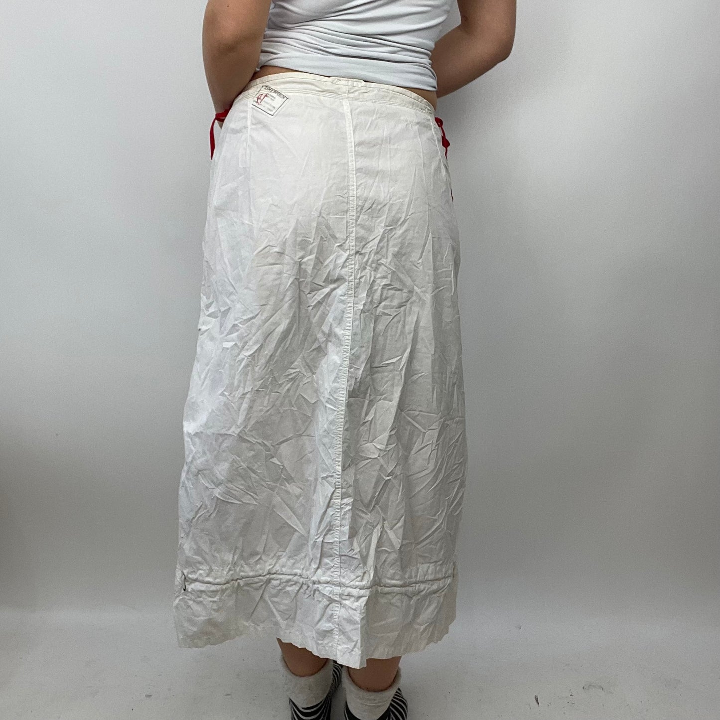 LIGHT ACADEMIA DROP | small white cargo skirt with red side toggles