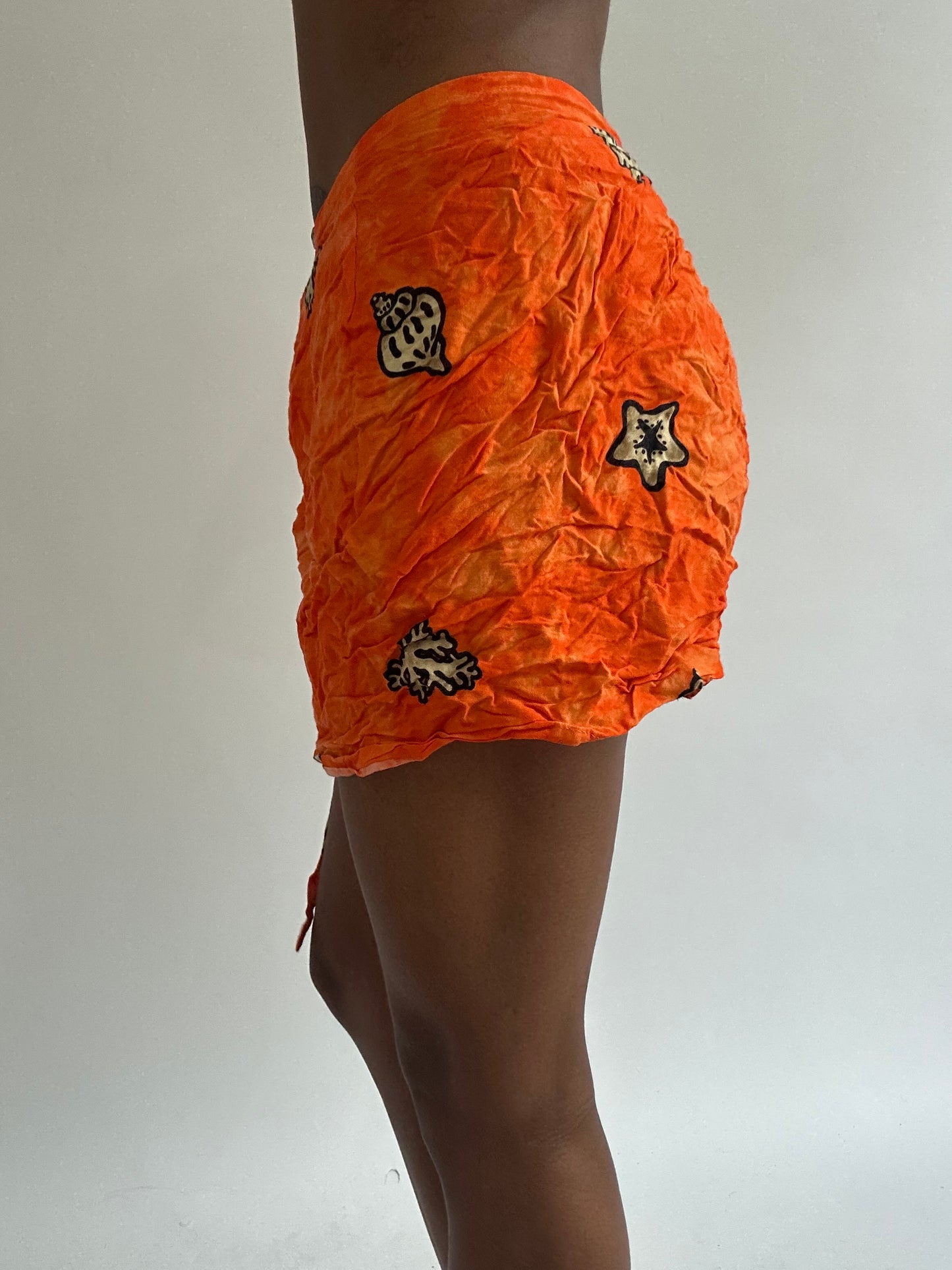 BEST PICKS | small orange patterned beach wrap skirt
