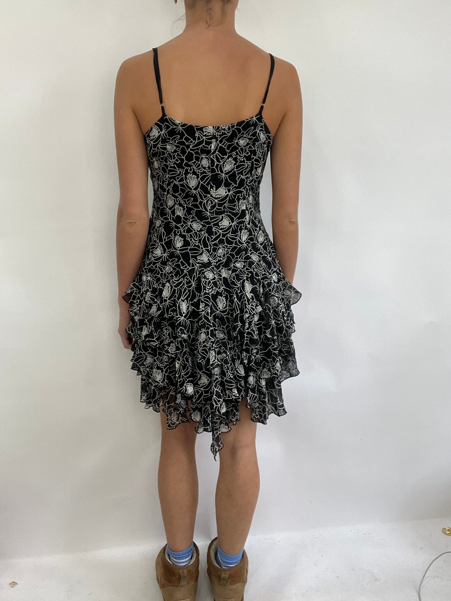 COACHELLA DROP | small black and white ruffle midi dress with floral pattern all over