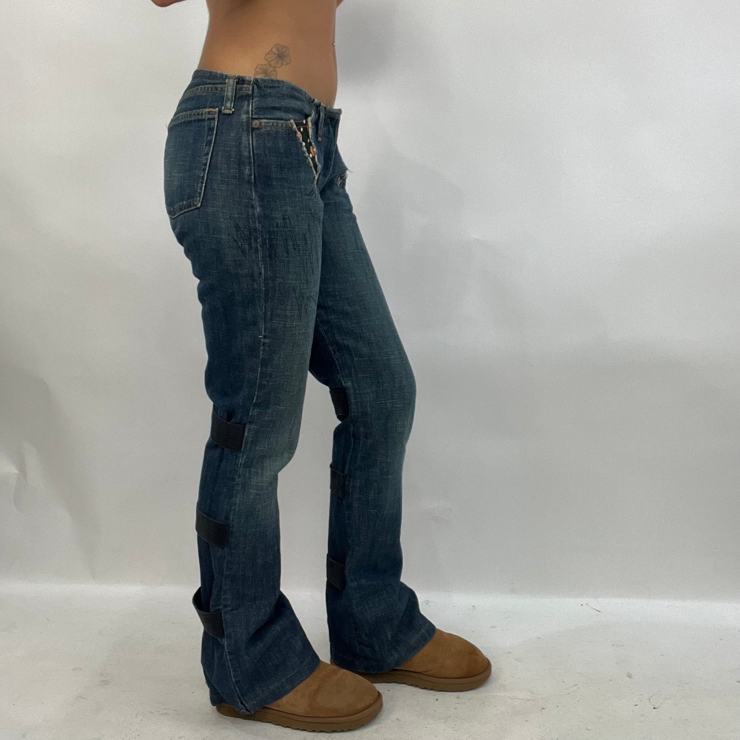 HIPPY CHIC DROP | small dark wash low waisted denim flared jeans with orange flower detail on pockets
