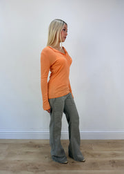medium orange ribbed button long sleeve top