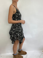 COACHELLA DROP | small black and white ruffle midi dress with floral pattern all over
