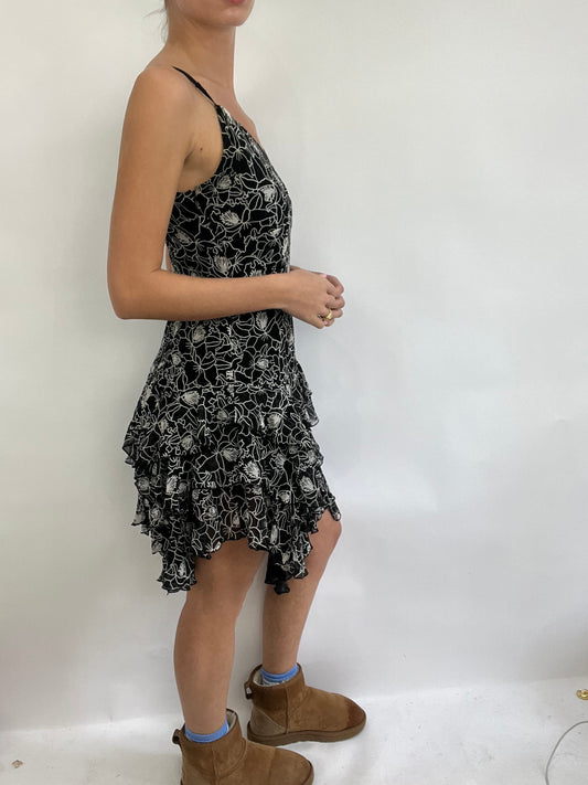 COACHELLA DROP | small black and white ruffle midi dress with floral pattern all over