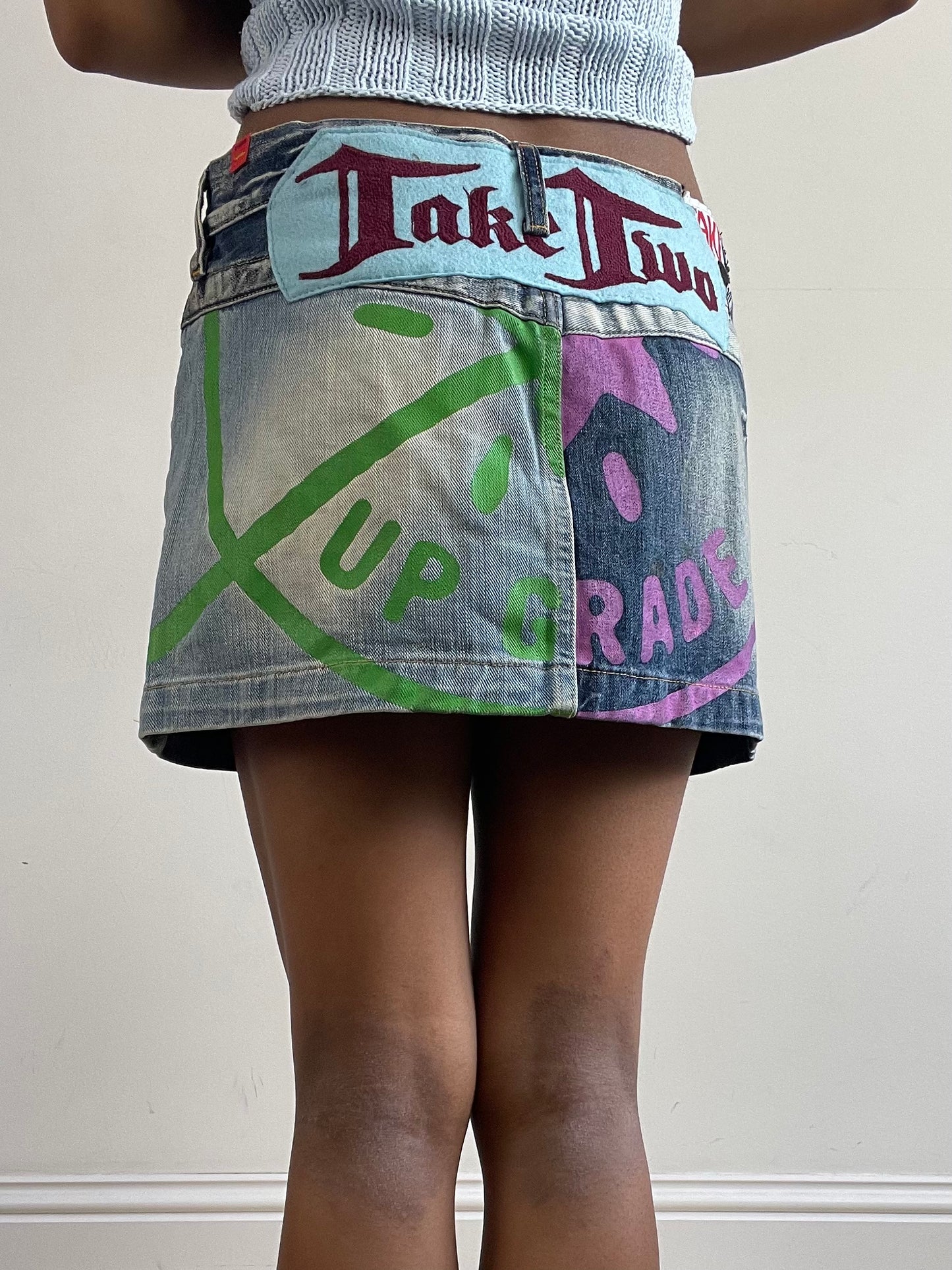 vintage edit twenty-seven | small blue take two denim mini skirt with logo and star graphic