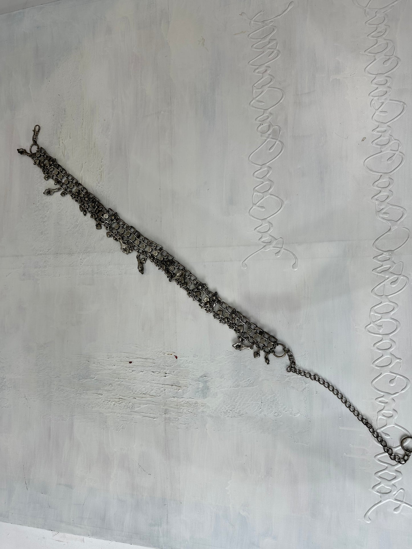 BEST PICKS | silver and blue chain belt with drop metal hardware details