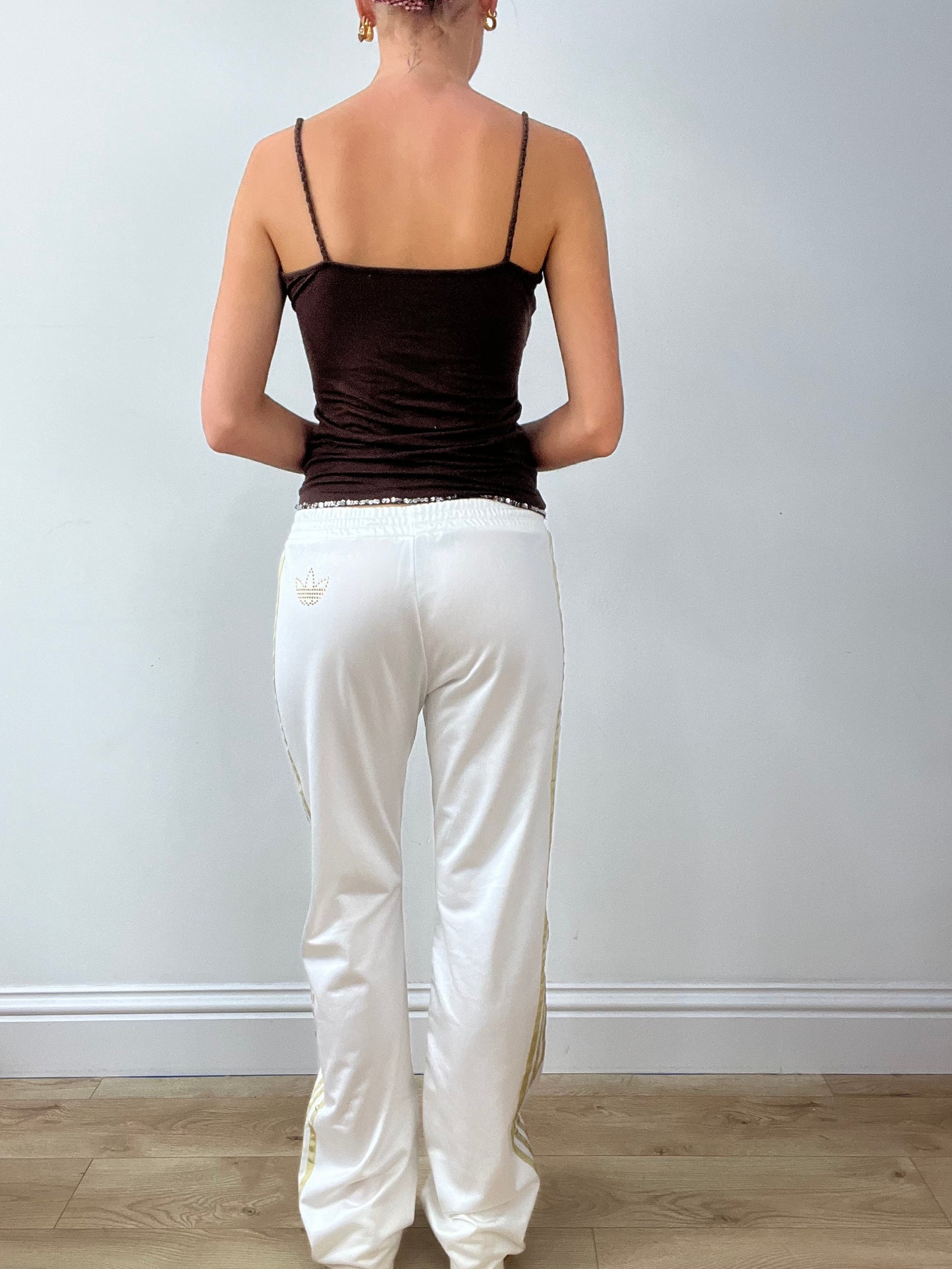 GIRLBAND DROP | medium white adidas tracksuit bottoms with gold stripes