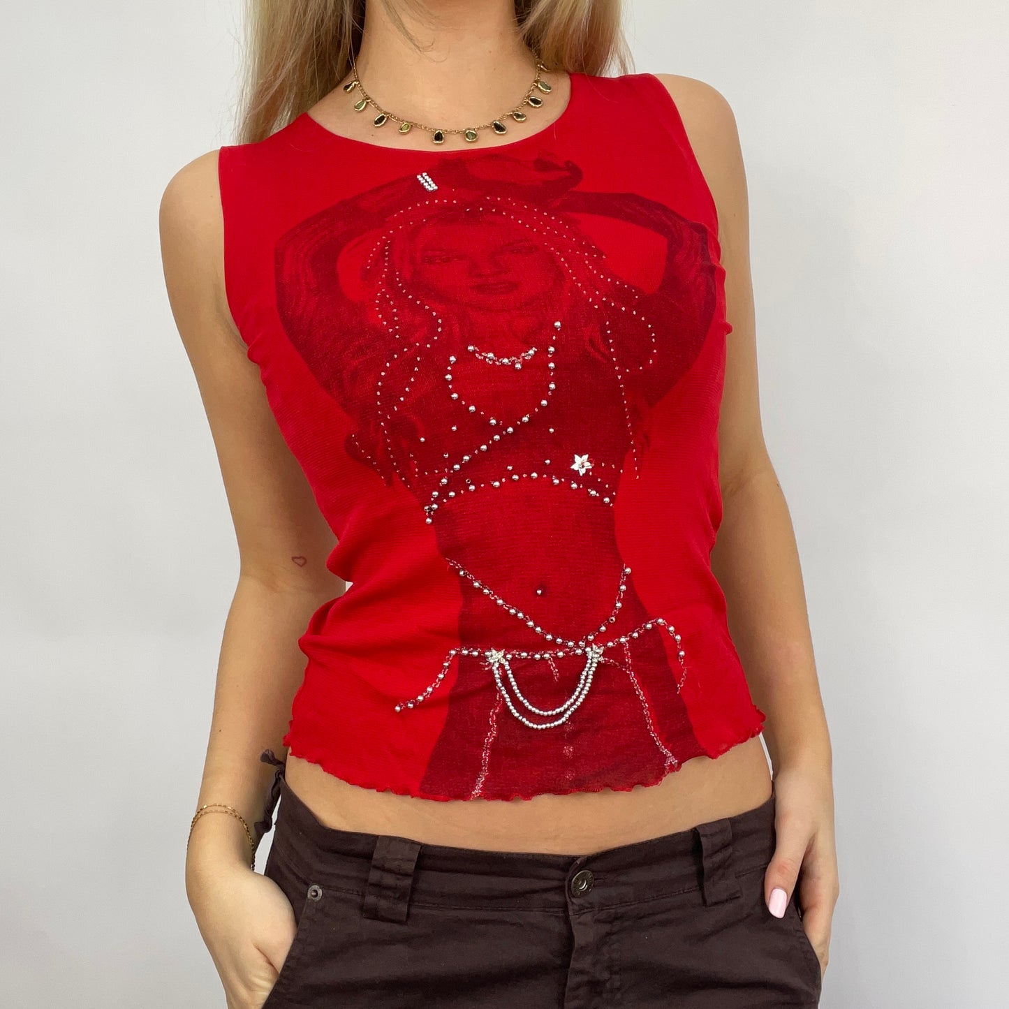 💻 STUDIO FAVES | small red mesh vest with graphic woman detail and diamantés