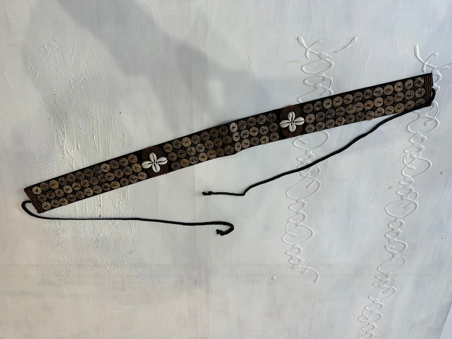 BEST PICKS | brown belt with button and shell detailing