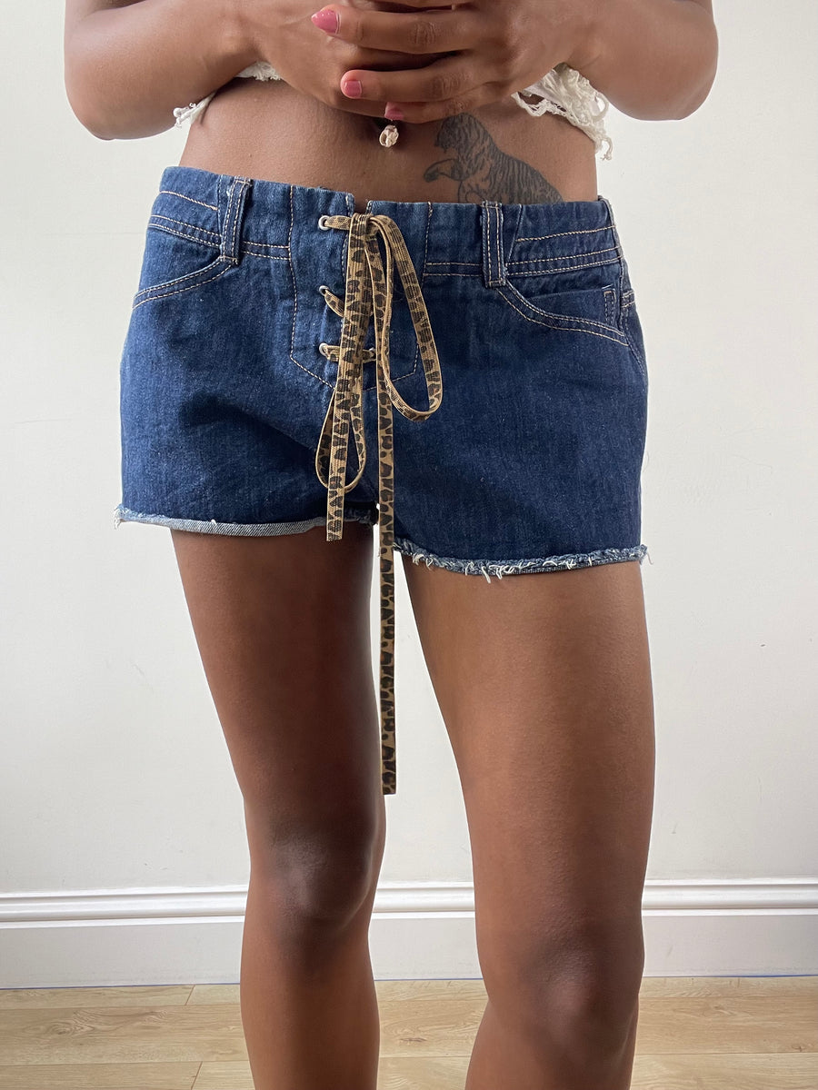 vintage edit: festival | small low waisted blue denim mini shorts with leopard print lace up ties
