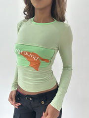 ‼️ | small green long sleeve top with ‘playground’ writing