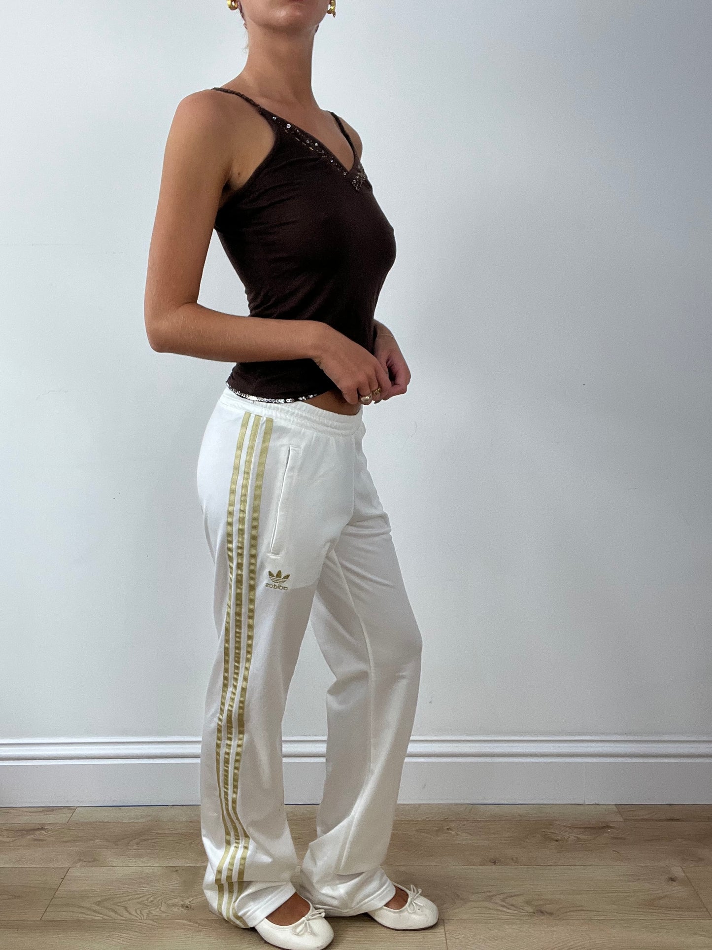 GIRLBAND DROP | medium white adidas tracksuit bottoms with gold stripes