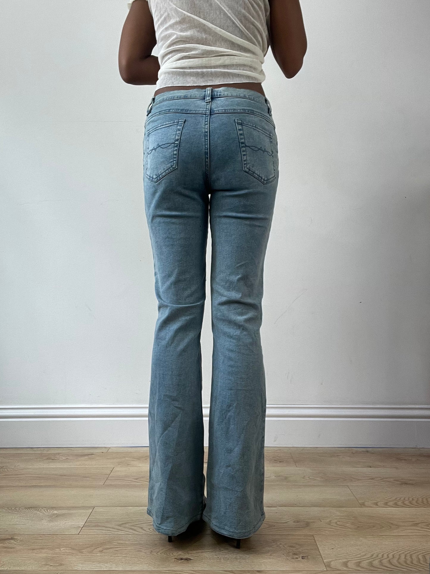 LFW edit | small blue denim jeans with floral embroidery and metal details