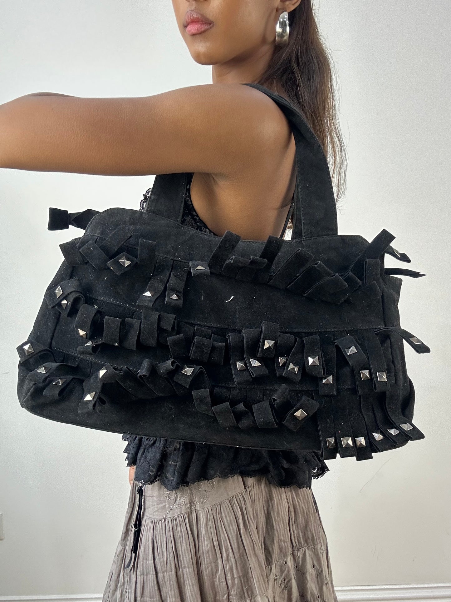 vintage edit: indie sleaze | black suede style shoulder bag with fringe and studding