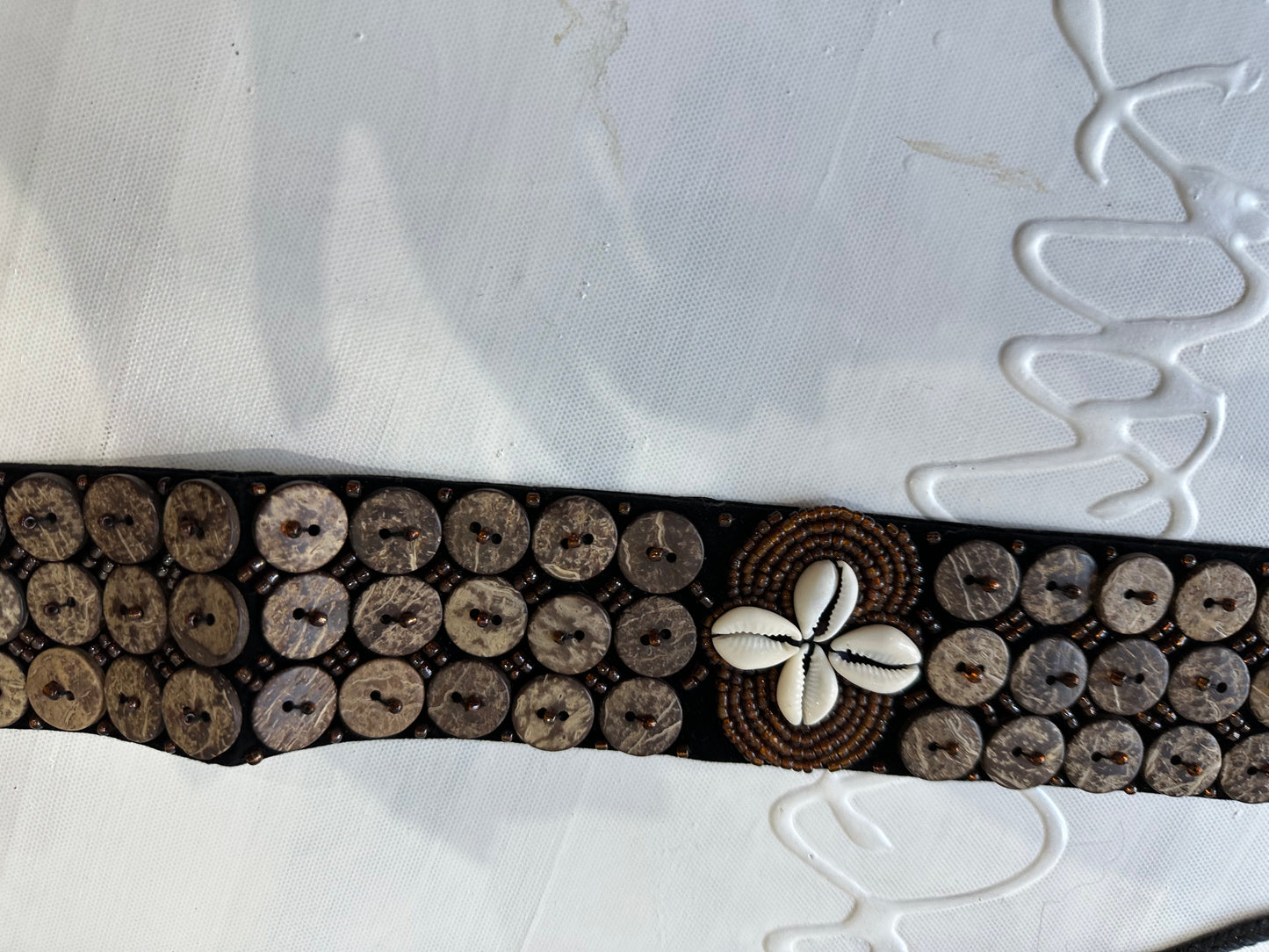 BEST PICKS | brown belt with button and shell detailing
