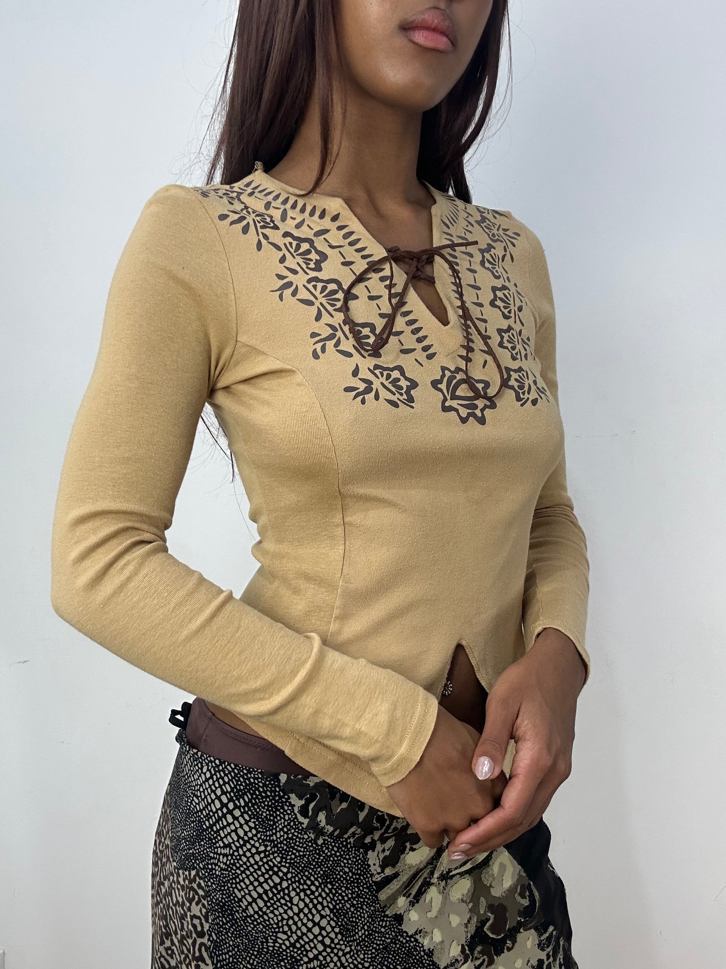 BEST PICKS | small tan long sleeve top with lace up front
