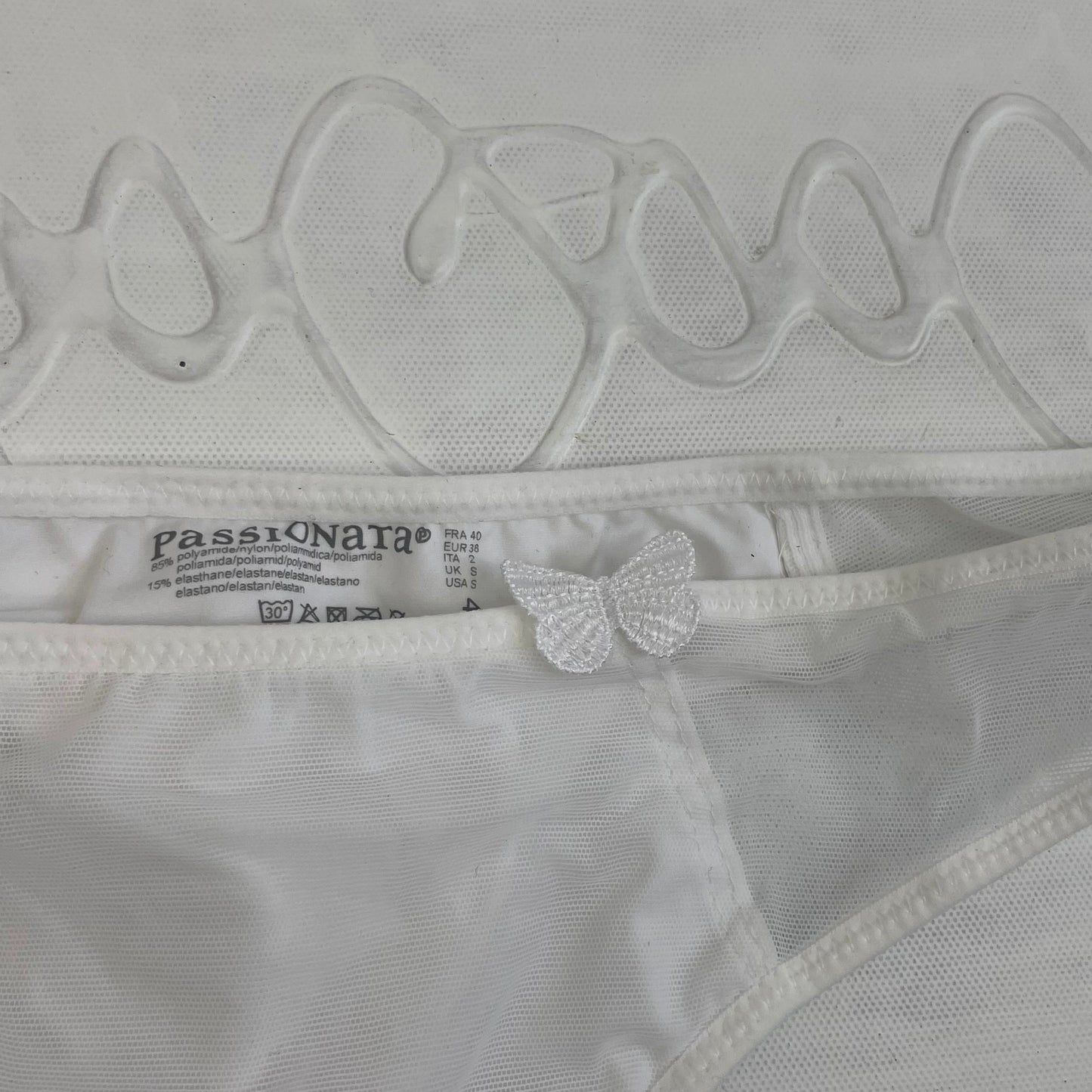 CHALET GIRL DROP | small white thong with butterfly detail