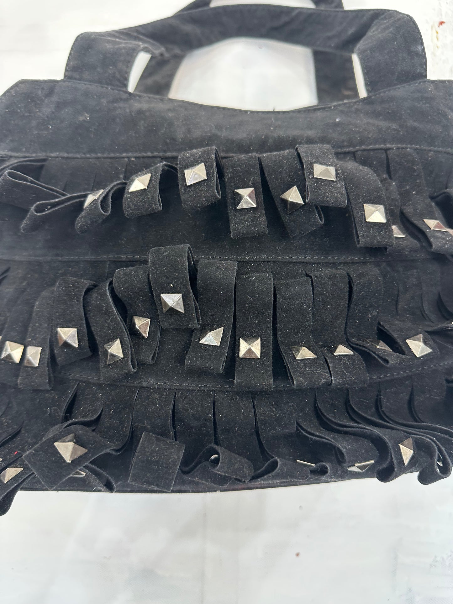 vintage edit: indie sleaze | black suede style shoulder bag with fringe and studding