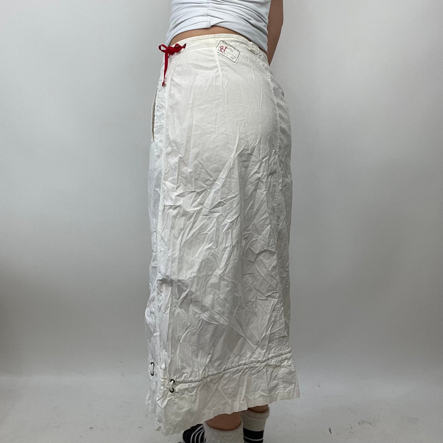 LIGHT ACADEMIA DROP | small white cargo skirt with red side toggles