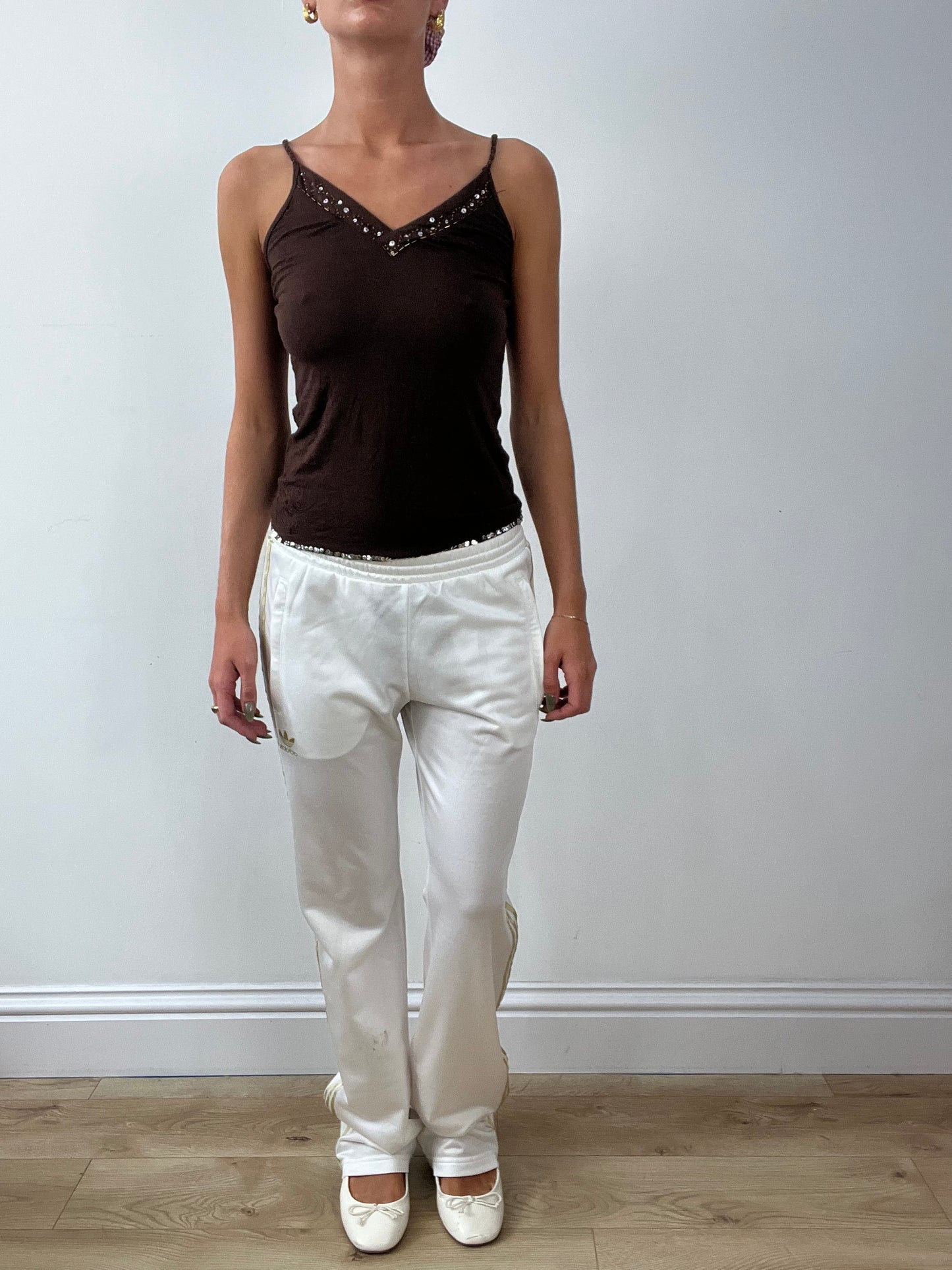 GIRLBAND DROP | medium white adidas tracksuit bottoms with gold stripes