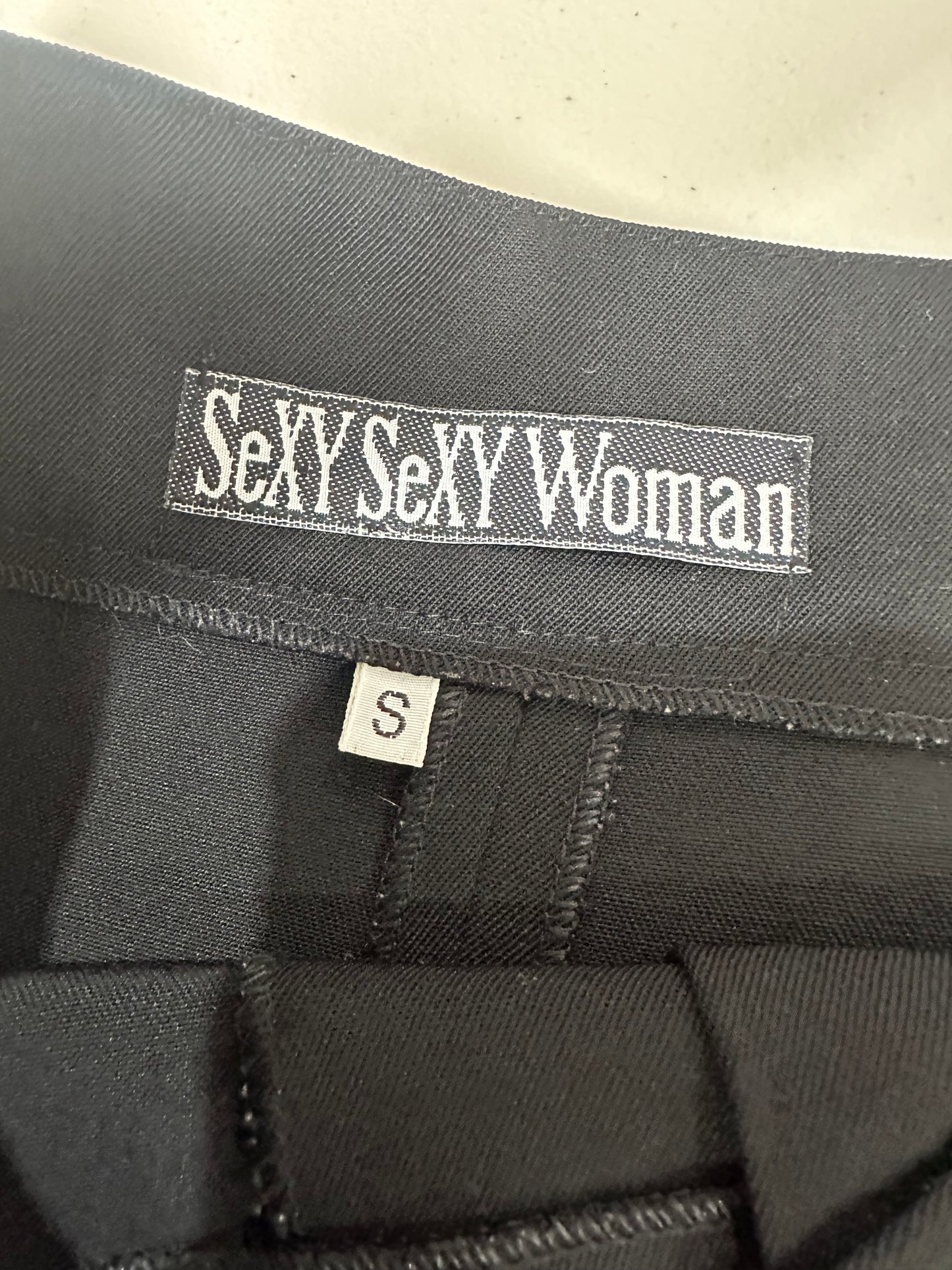 devil wears prada | small black button detail mini skirt