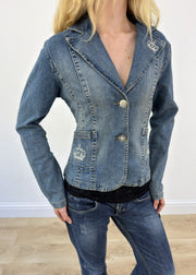 small denim blazer with embroidered crowns - face close-up