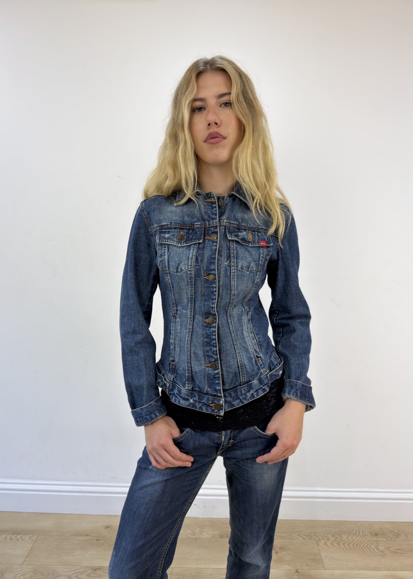 small dark wash denim jacket - face close-up