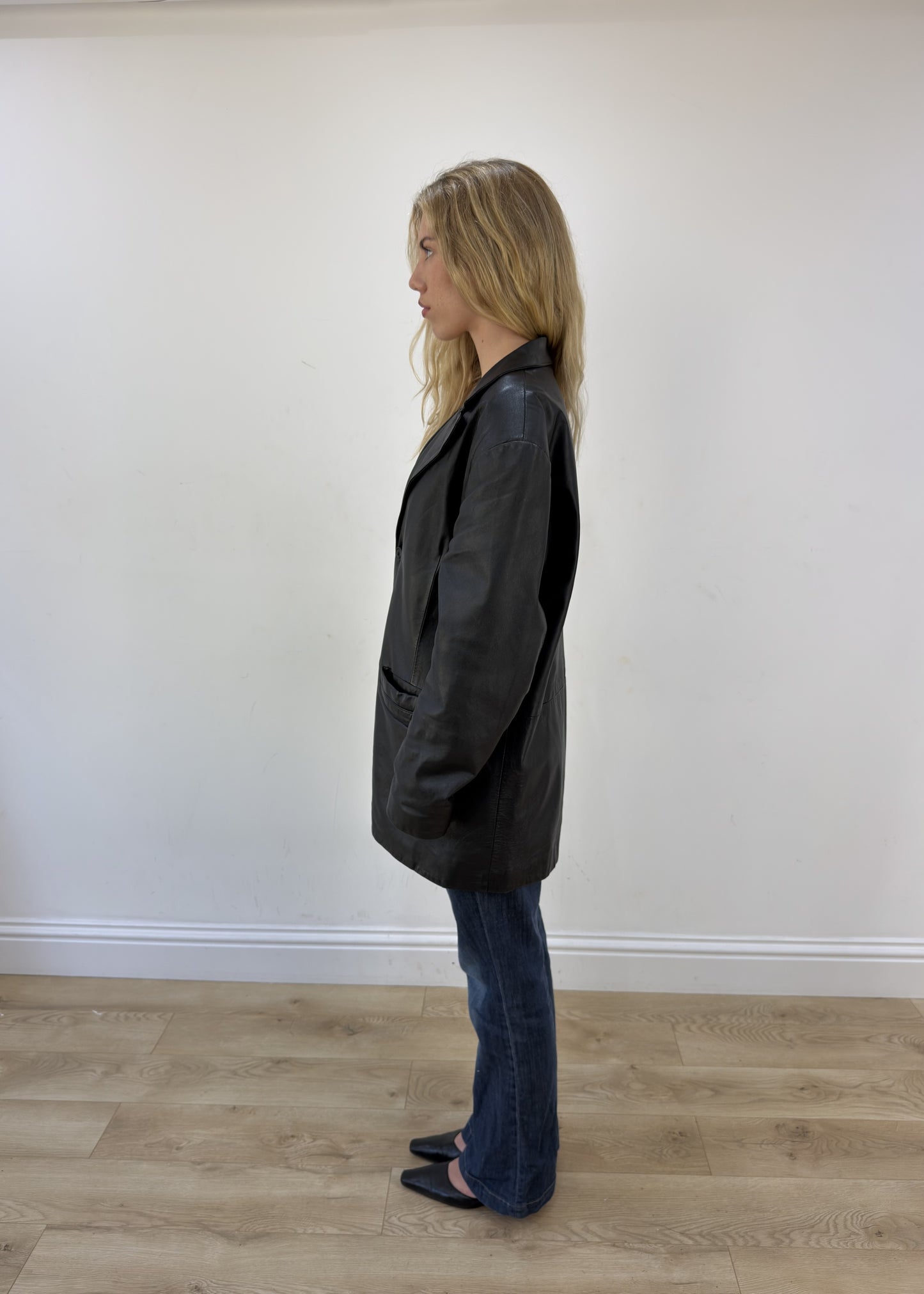 large black faux leather long jacket - side view