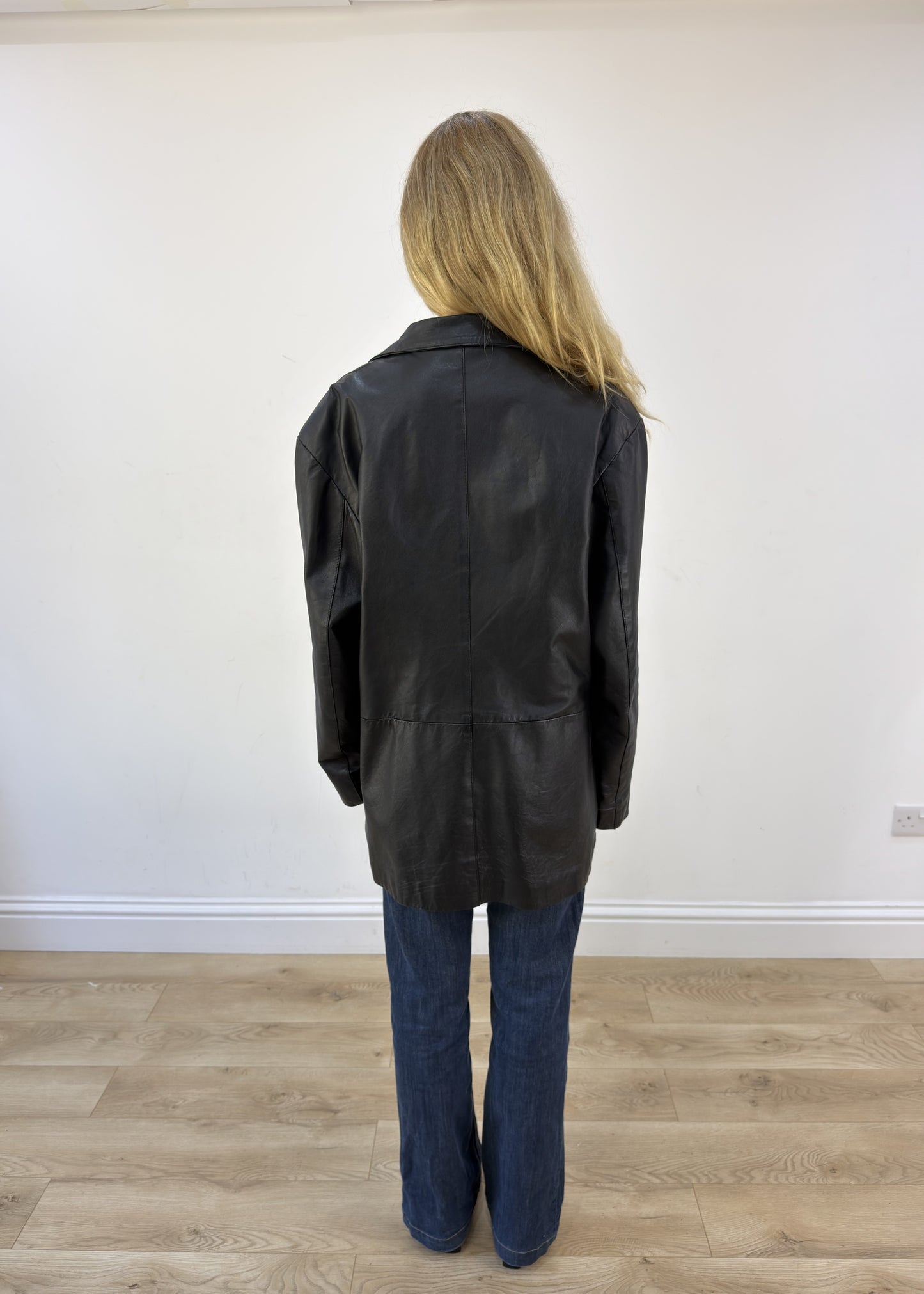large black faux leather long jacket - back view