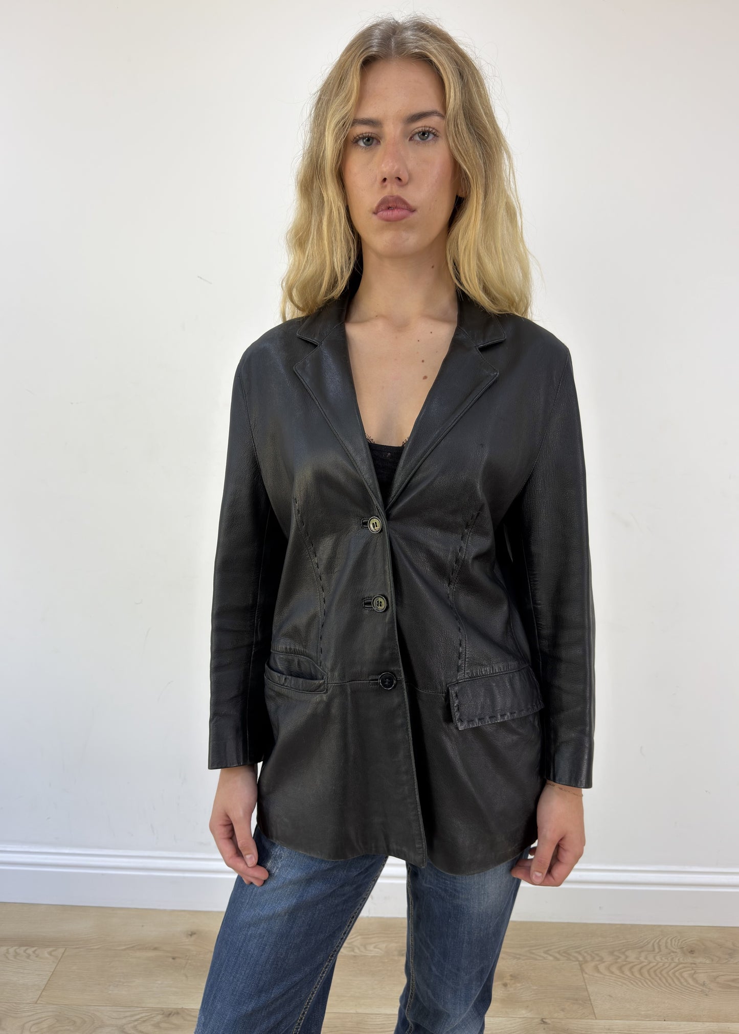 large black faux leather long jacket - face close-up