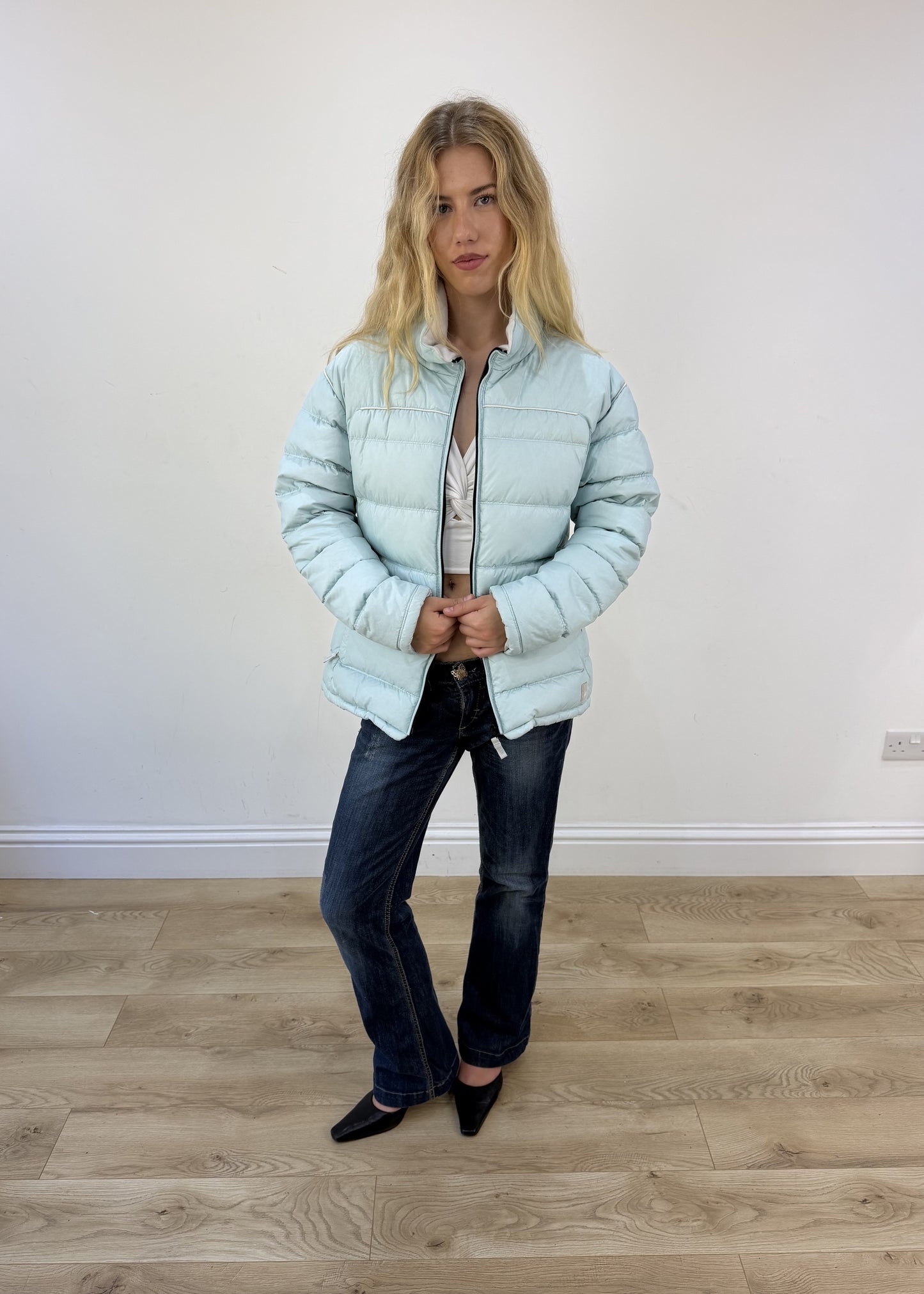 small pale blue puffer jacket open or unzipped view