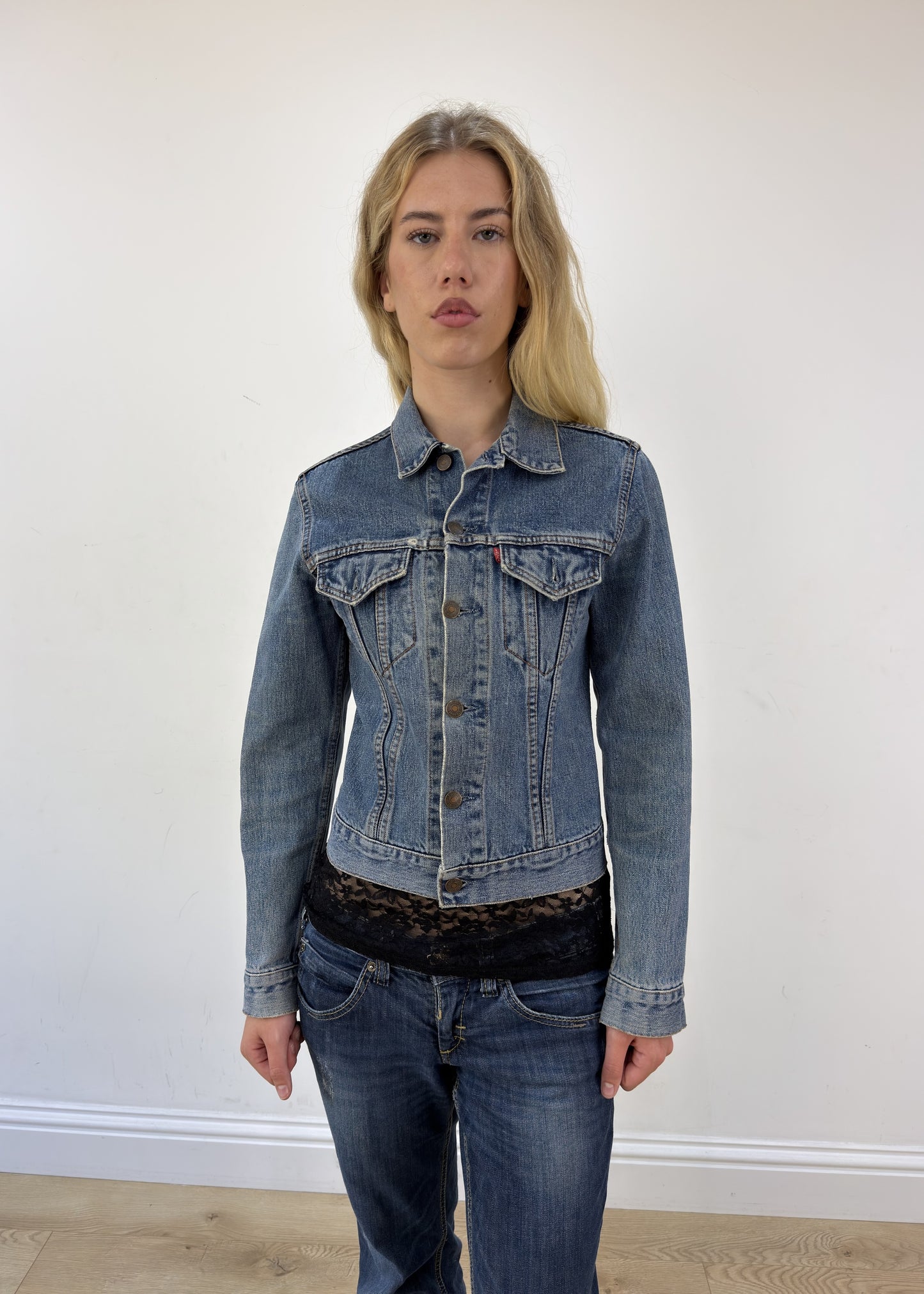 small blue Levi's denim jacket - face close-up