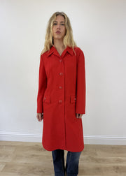 medium red trench coat - face close-up
