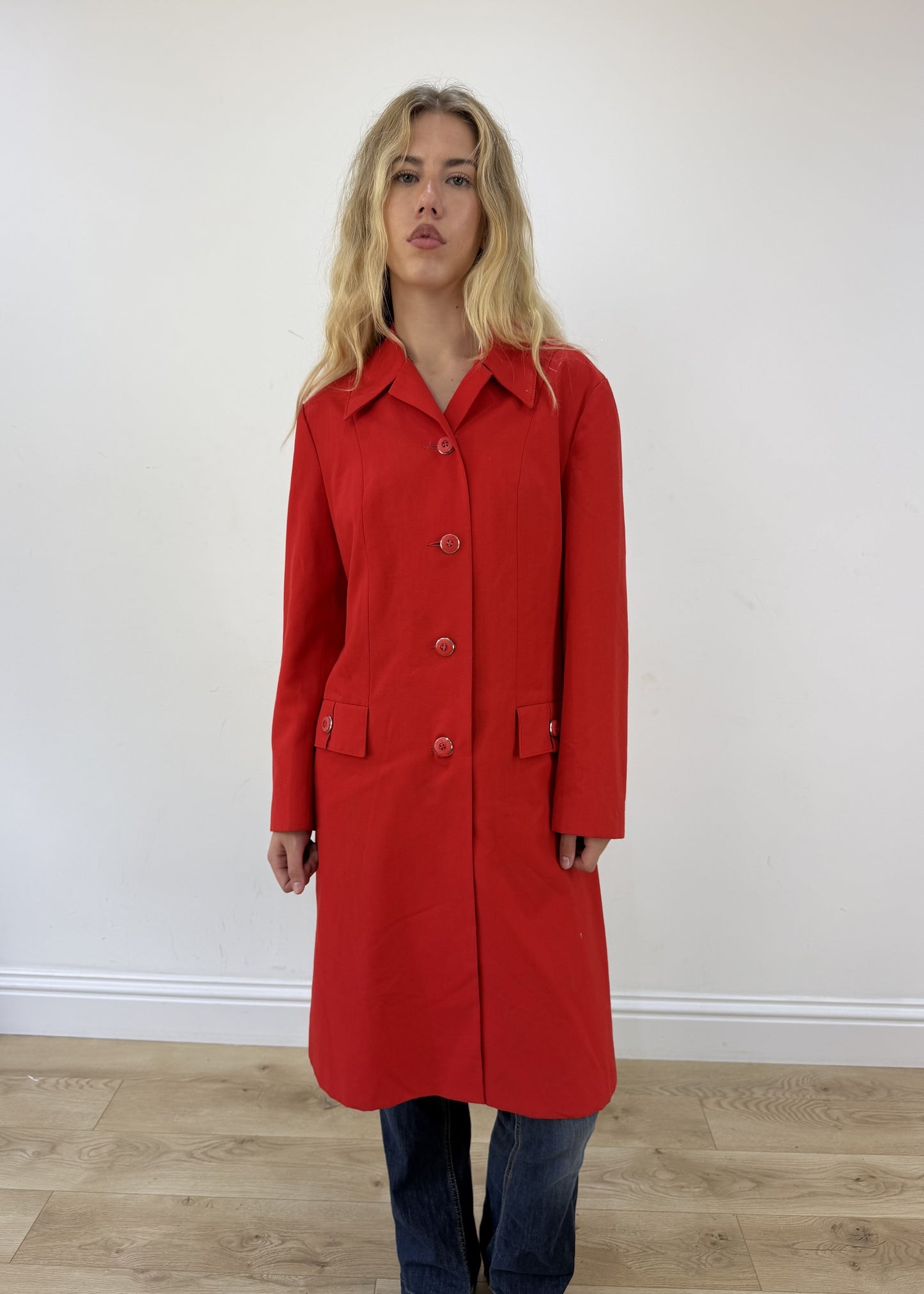 medium red trench coat - face close-up