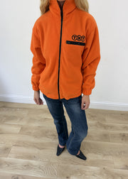 extra large orange TNT zip fleece - aesthetic close-up