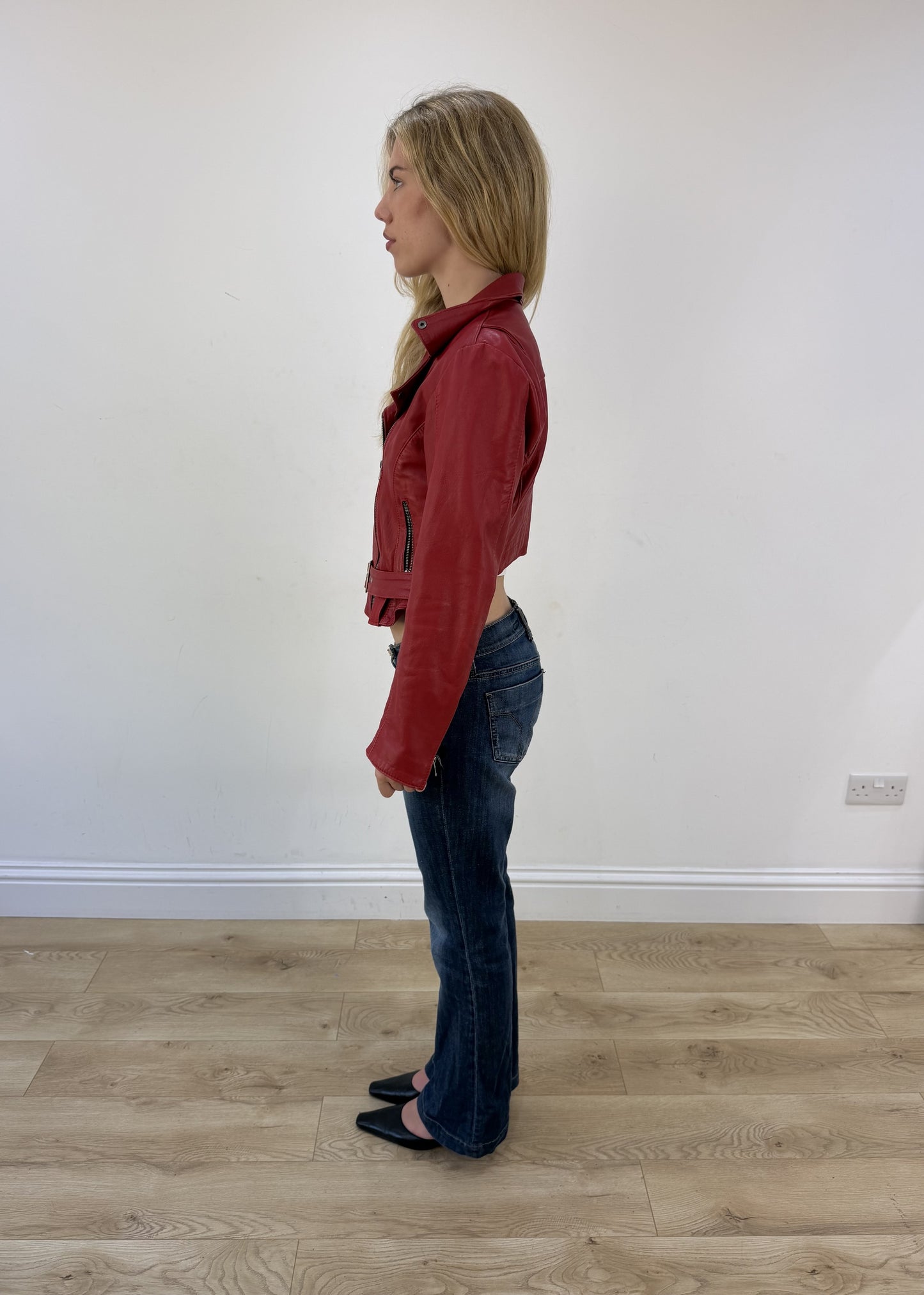 small red faux leather belted jacket - side view