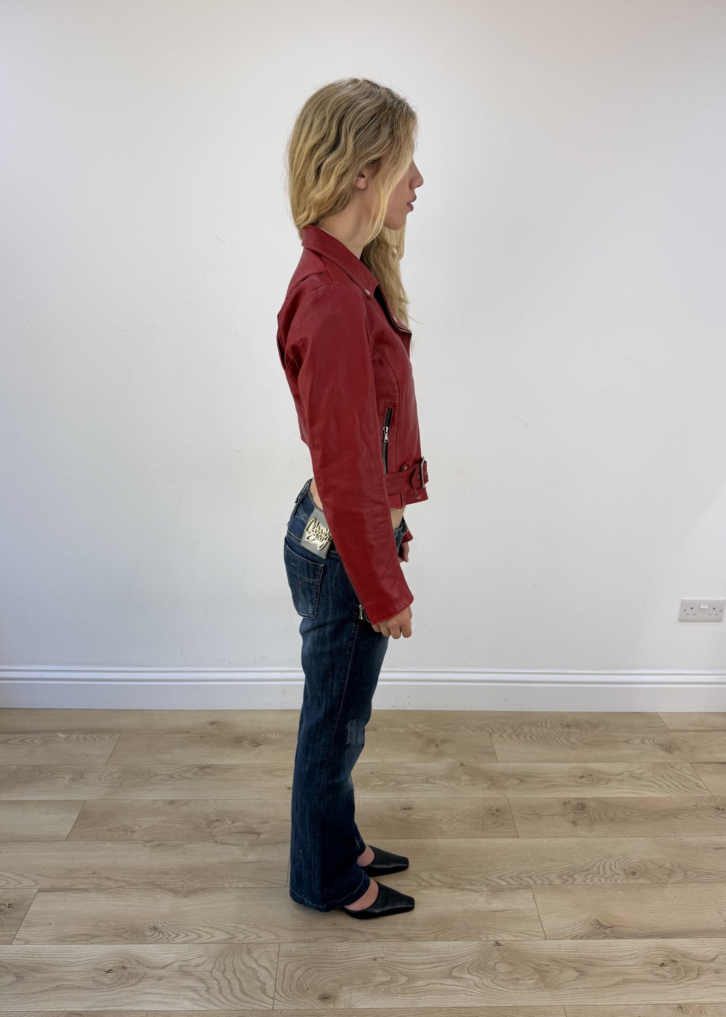 small red faux leather belted jacket - other side view