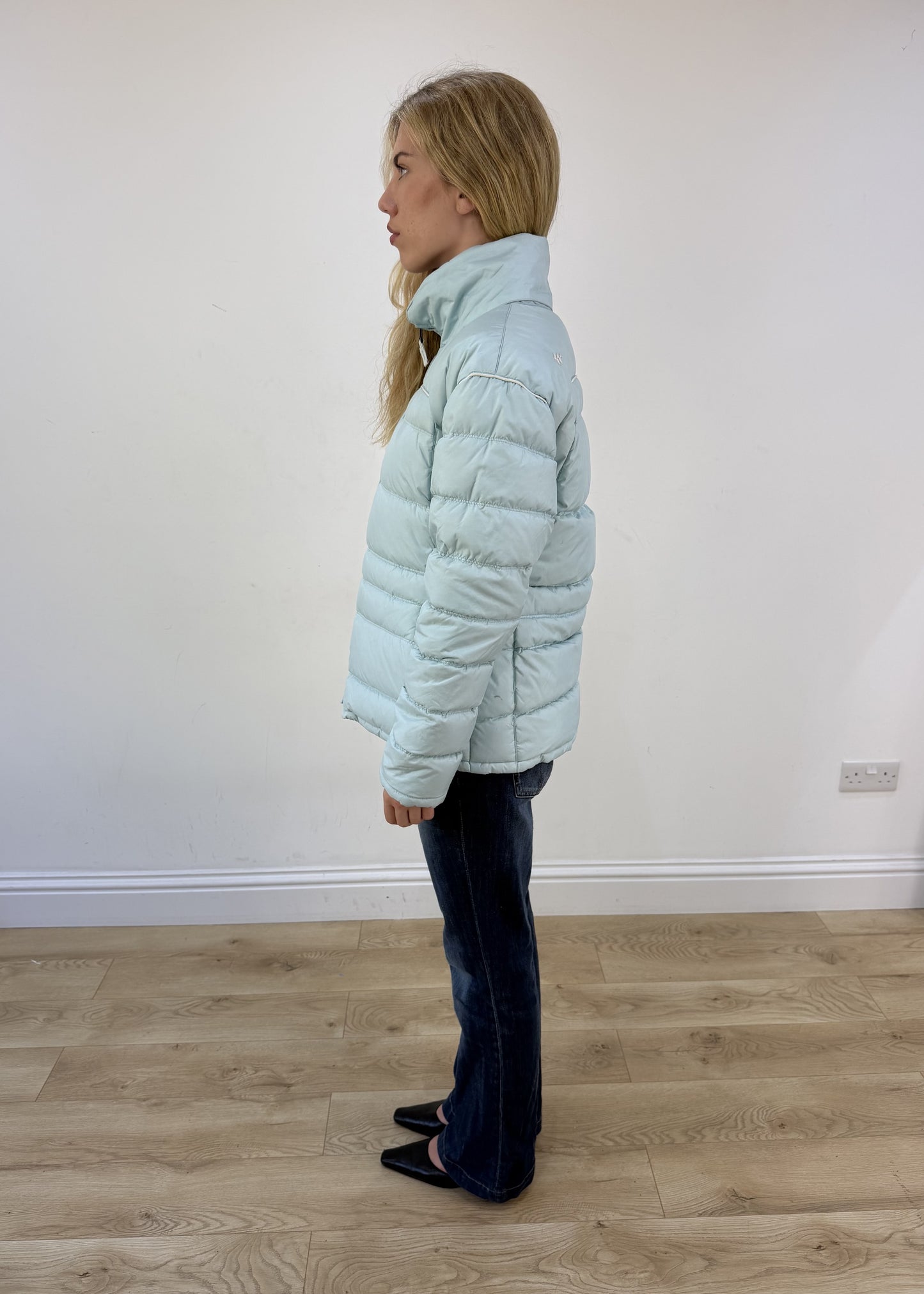small pale blue puffer jacket - side view