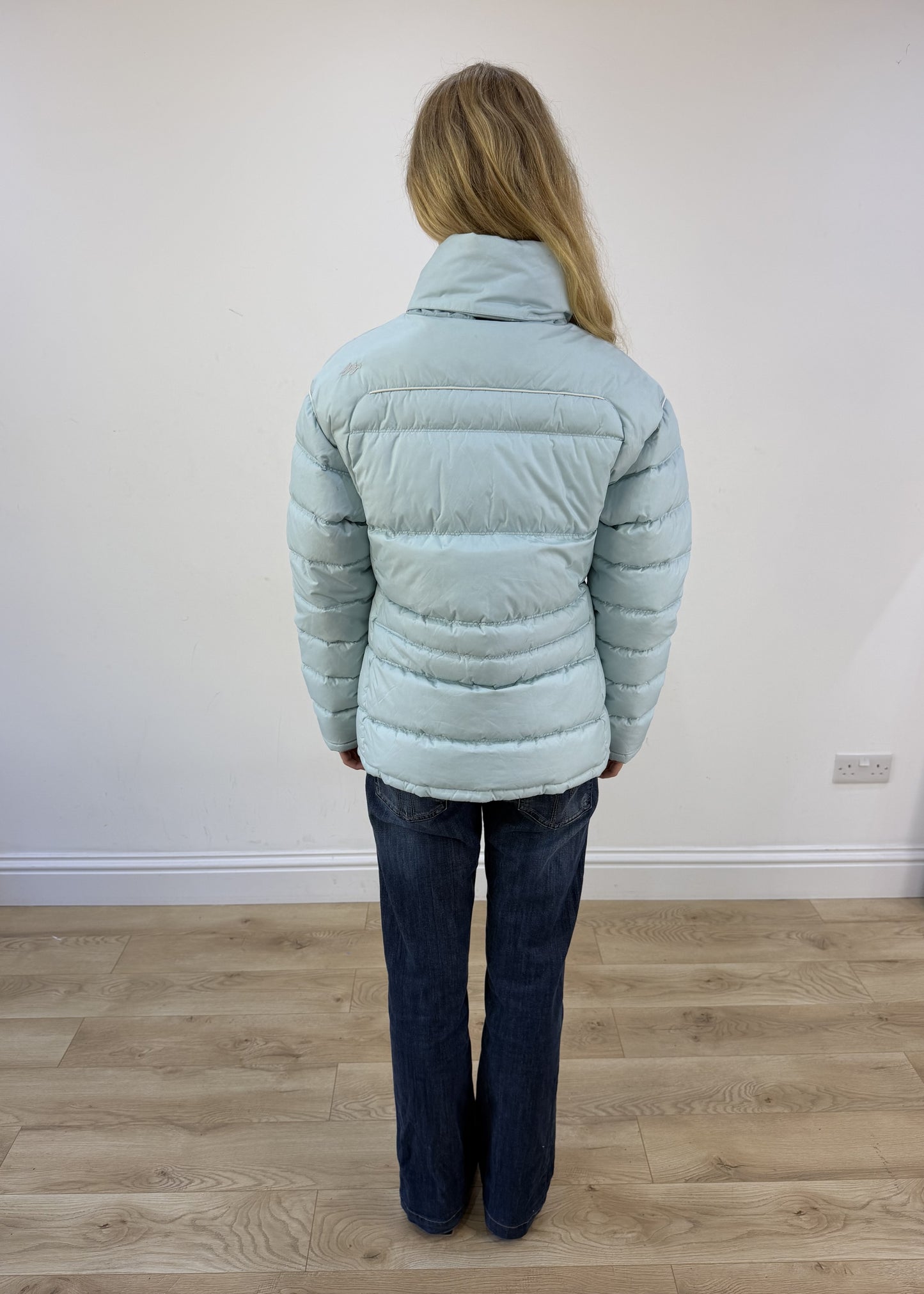small pale blue puffer jacket - back view
