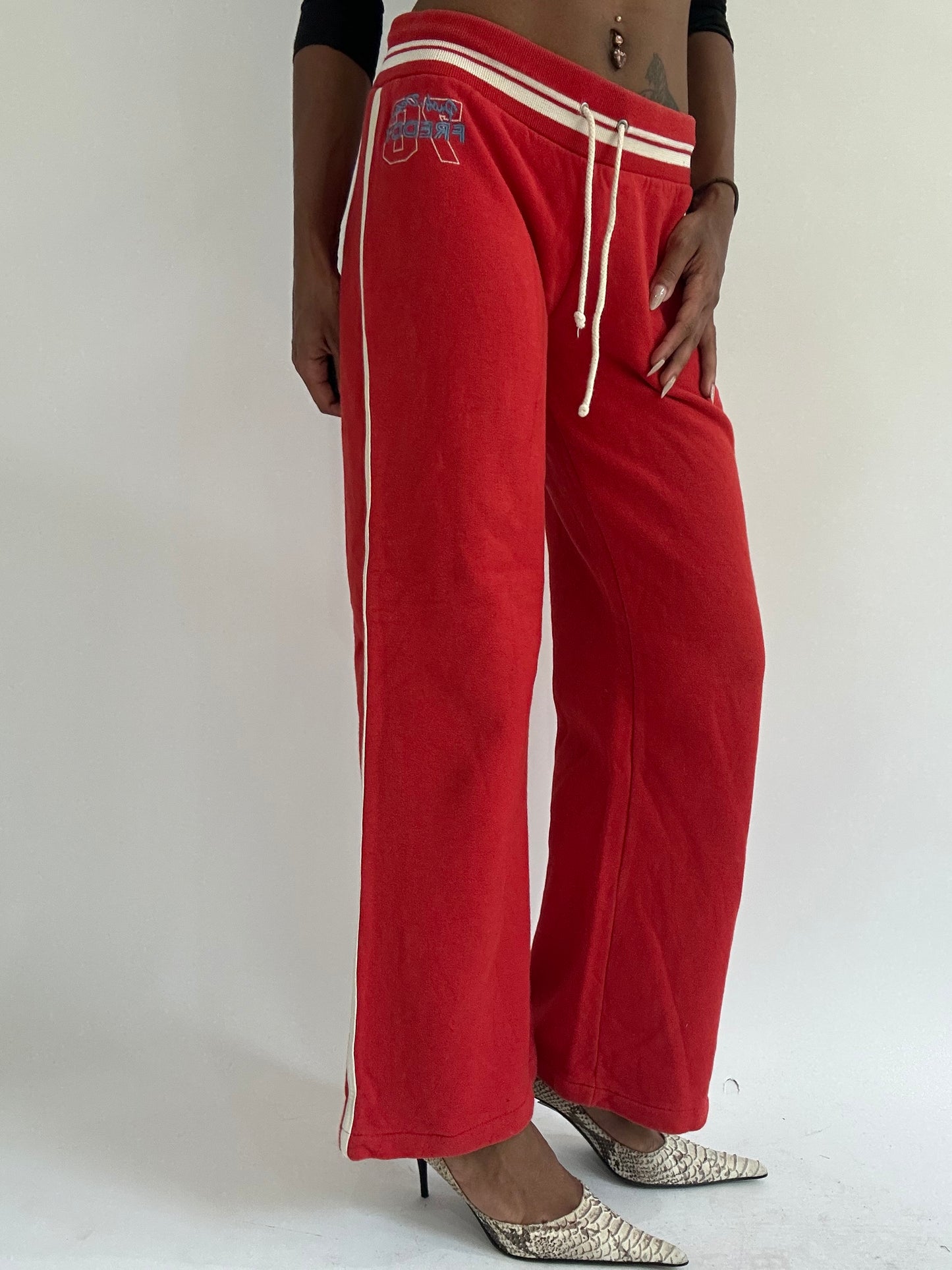 euro trash | small red tracksuit bottoms