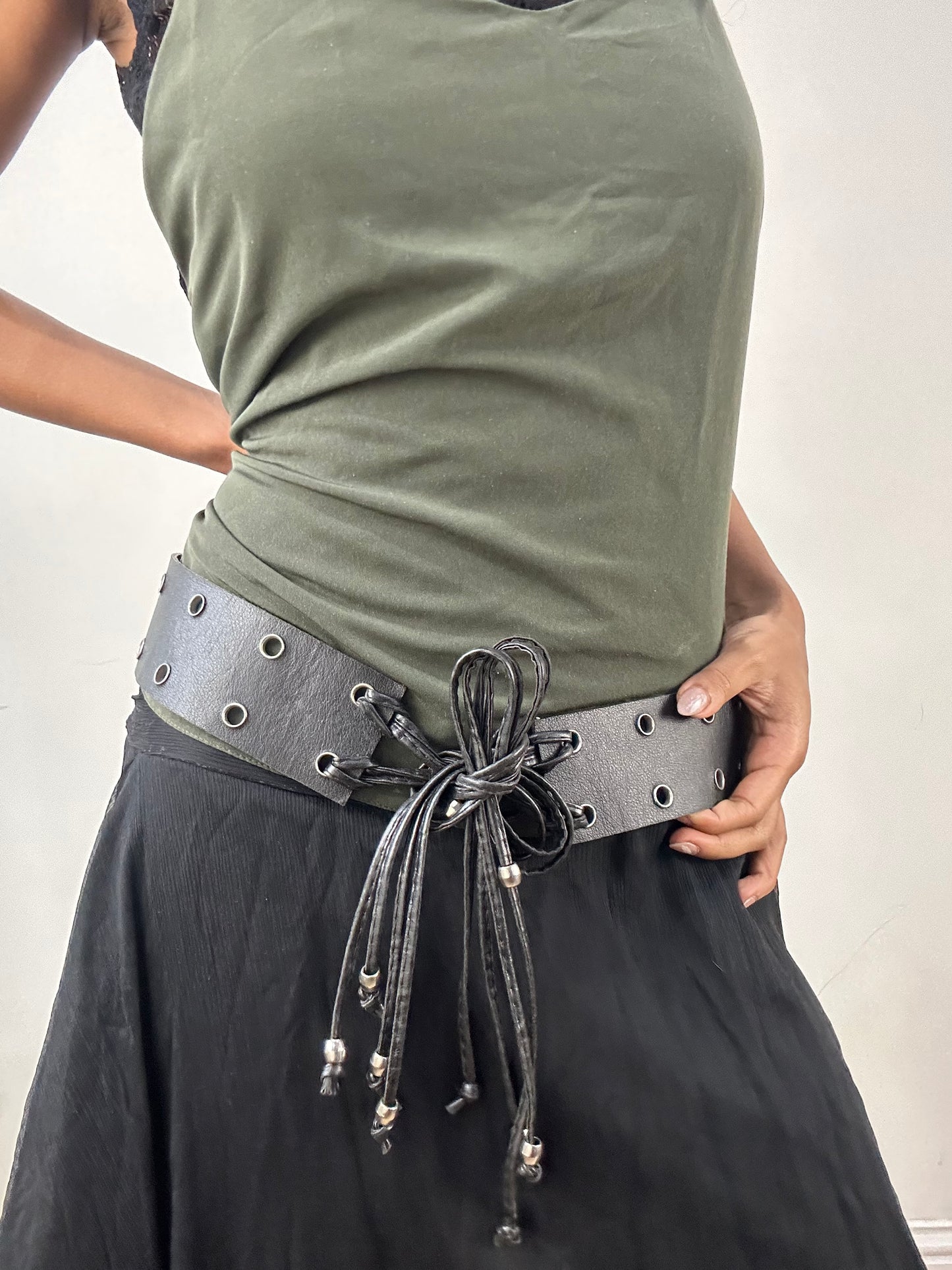 vintage edit: indie sleaze | black faux leather belt with silver eyelet details