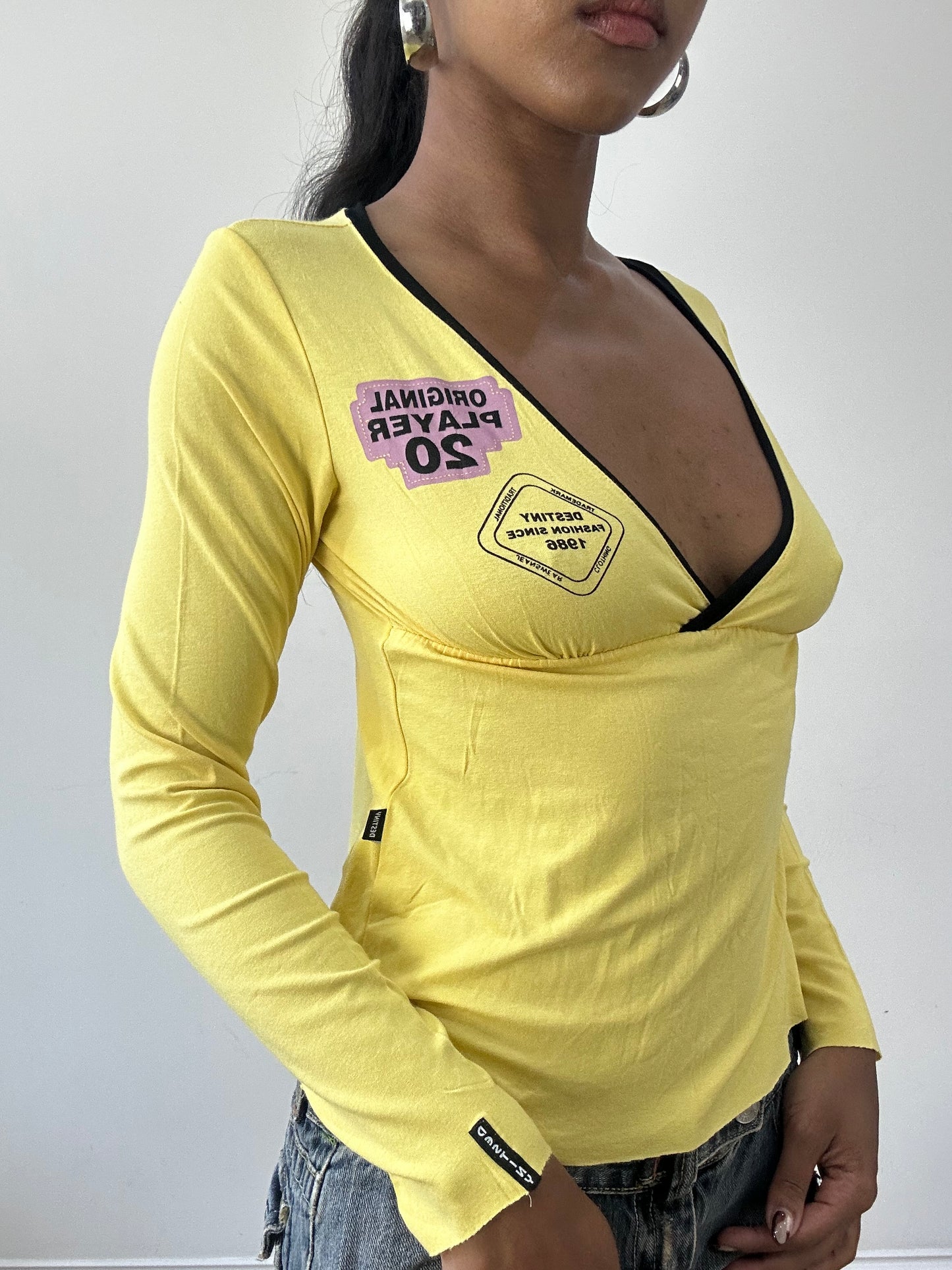 BEST PICKS | small yellow long sleeve top with cutout back detail