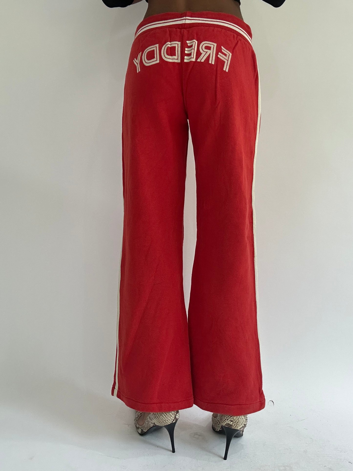 euro trash | small red tracksuit bottoms
