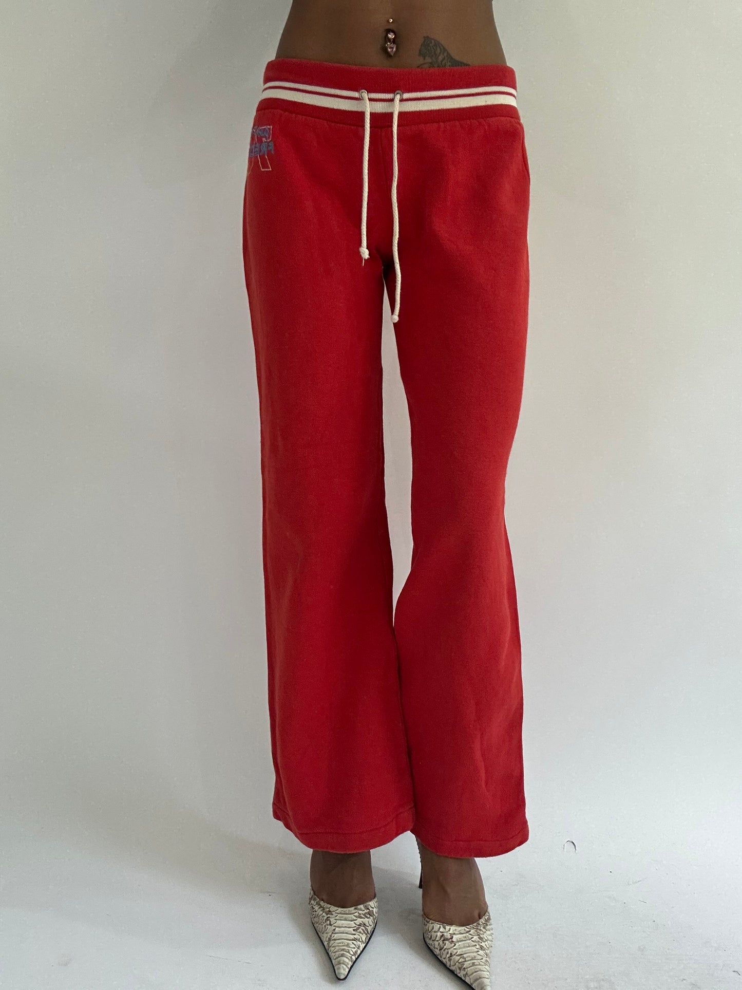 euro trash | small red tracksuit bottoms