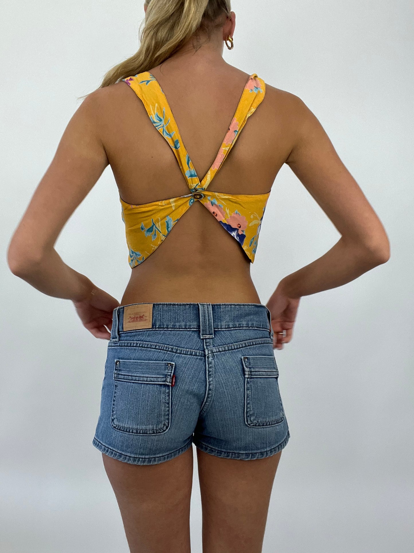COASTAL COWGIRL DROP | small yellow reversible cropped top with blue floral print