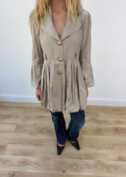 small beige bubble trench coat
