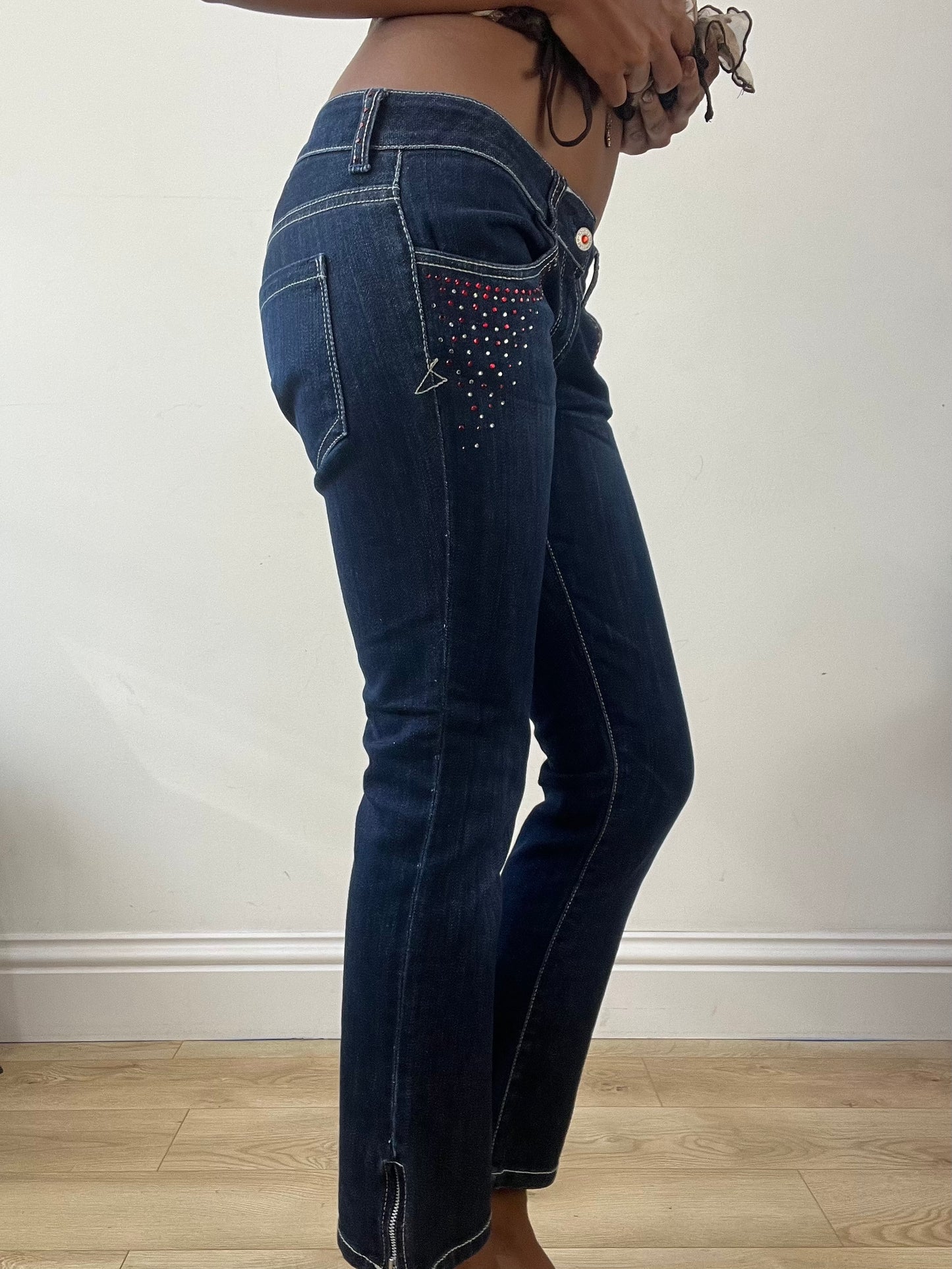 BEST PICKS | small blue denim bootcut jeans with rhinestone details
