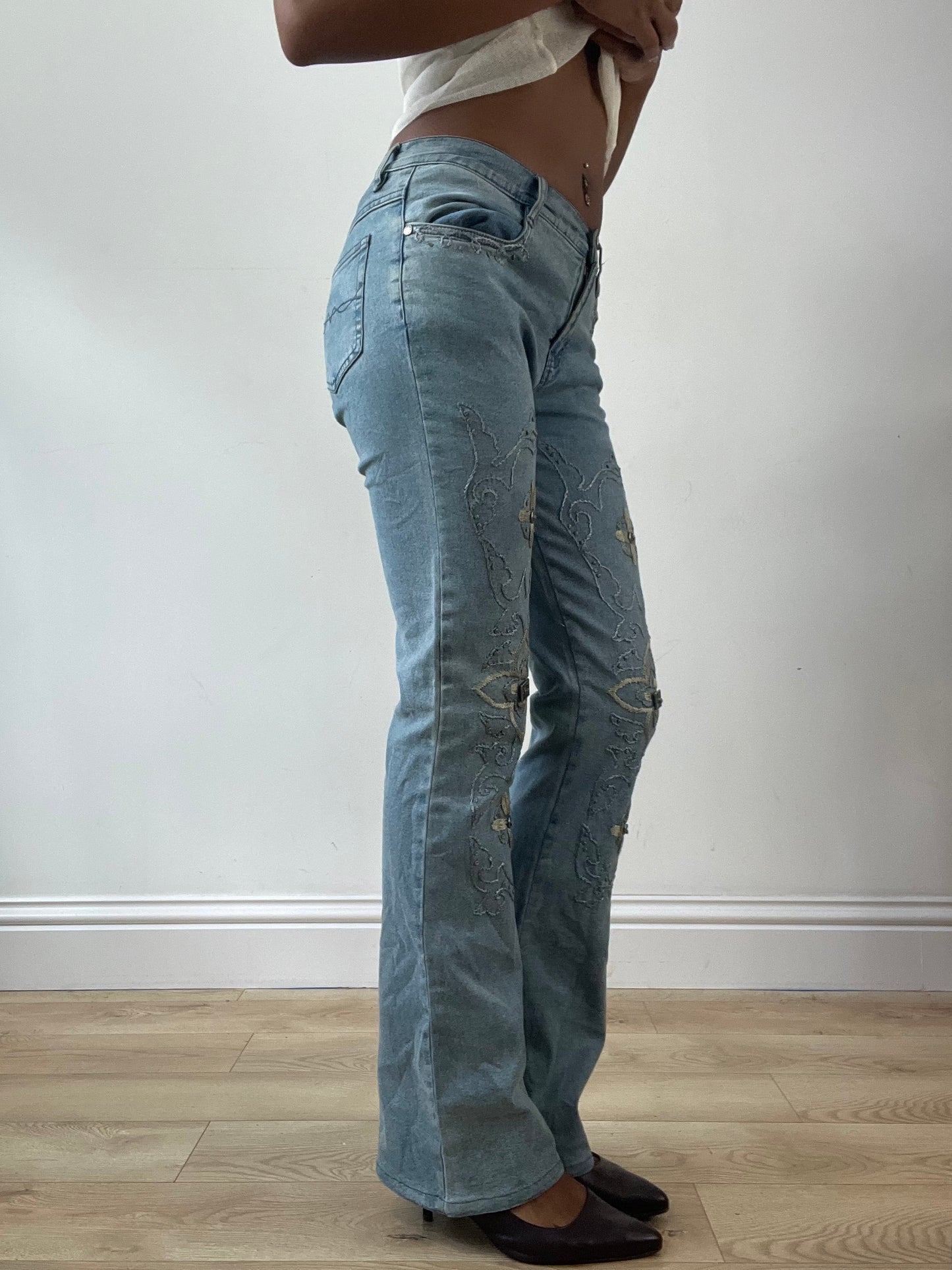 LFW edit | small blue denim jeans with floral embroidery and metal details