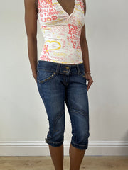 Vintage edit dieciocho | jeans capri azules extra pequeños con parche de estrella