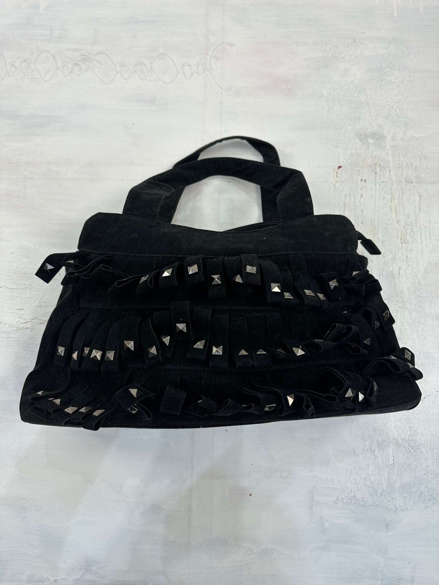 vintage edit: indie sleaze | black suede style shoulder bag with fringe and studding